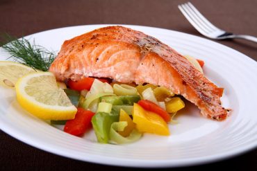 Freshly grilled salmon with seasonal vegetables served at Platters St Neots